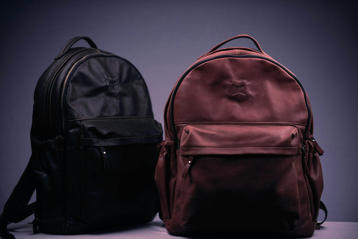Black and brown backpack on a white textile