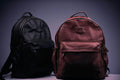 Black and brown backpack on a white textile