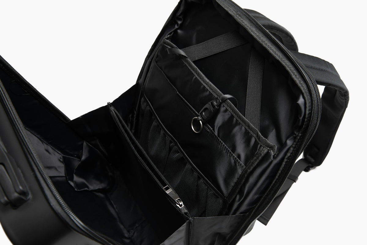 Black backpack with a padded shoulder strap